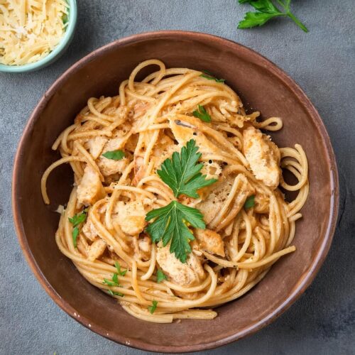 Rich and creamy Cheesy Chicken Spaghetti made with tender shredded chicken, al dente pasta, and a blend of melted cheeses. This comforting casserole is packed with flavor, combining savory seasonings, diced tomatoes, and a creamy cheese sauce that coats every bite. Perfect for busy weeknights or potlucks, this easy-to-make dish is a family favorite and always a crowd-pleaser.