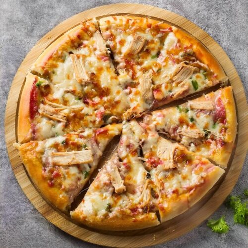 Delicious Chicken Pizza topped with tender, seasoned chicken, gooey mozzarella cheese, and your choice of flavorful toppings like bell peppers, onions, or mushrooms. This crispy, homemade pizza features a rich tomato sauce base and a perfectly baked crust, offering a mouthwatering combination of savory chicken and melty cheese. Perfect for pizza night or casual gatherings, this crowd-pleasing pizza will satisfy any craving