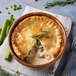 Classic Chicken Pot Pie filled with tender chicken, hearty vegetables, and a creamy, savory sauce, all baked inside a flaky, golden-brown crust. This comforting dish features a rich blend of carrots, peas, and celery, making it a perfect family-friendly meal for weeknights or cozy gatherings. Serve this homemade pot pie for a satisfying and hearty dinner that’s sure to be a hit.
