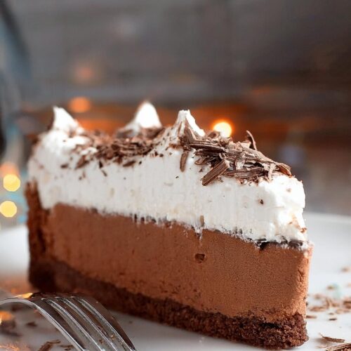 Luxuriously creamy Chocolate Mousse Pie, featuring a smooth, airy chocolate mousse filling atop a buttery, crisp chocolate cookie crust. This decadent dessert is the perfect balance of rich chocolate flavor and light, velvety texture, making it an irresistible treat for any occasion. Topped with whipped cream or chocolate shavings, this pie is an elegant, no-bake dessert that's easy to make and sure to impress.