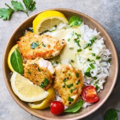 Tender Lemon Chicken Romano, featuring pan-seared chicken breasts coated in a zesty lemon and Romano cheese sauce. This flavorful dish is enhanced with fresh herbs and a touch of garlic, creating a tangy and creamy sauce that perfectly complements the juicy chicken. Ideal for a quick weeknight dinner or a special occasion, this recipe is both easy to prepare and sure to impress with its bright, savory flavors.