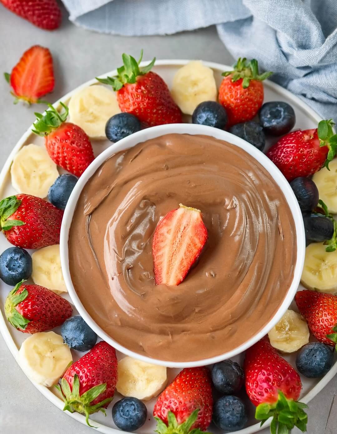 Rich and creamy Chocolate Fruit Dip, made with smooth melted chocolate and a hint of vanilla, perfect for dipping fresh fruits like strawberries, bananas, and apples. This indulgent yet simple dessert dip is ideal for parties, gatherings, or a fun snack. Serve with an assortment of fruits, pretzels, or marshmallows for a delightful treat that everyone will love