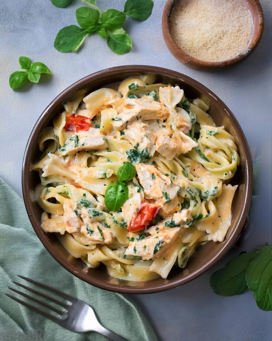 Instant Pot Creamy Tuscan Chicken Pasta, featuring tender chicken, perfectly cooked pasta, and a rich, garlicky Parmesan cream sauce with sun-dried tomatoes and spinach. This easy, one-pot meal is full of Italian-inspired flavors and ready in minutes, making it the perfect dinner option for busy weeknights. Creamy, flavorful, and satisfying, this dish is sure to become a family favorite