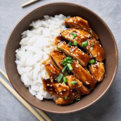 Juicy and flavorful Teriyaki Chicken, glazed with a sweet and savory homemade teriyaki sauce made from soy sauce, ginger, garlic, and a hint of honey. This easy-to-make dish features tender chicken breasts or thighs, perfectly grilled or stir-fried to create a delicious caramelized finish. Serve with steamed rice and vegetables for a satisfying and balanced meal that’s sure to please