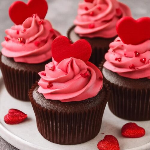 Rich and moist Chocolate Cupcakes topped with a luscious Raspberry Buttercream Frosting. The deep chocolate flavor pairs perfectly with the sweet, slightly tart raspberry frosting, creating a beautiful balance in each bite. These cupcakes are perfect for any celebration, offering a delightful mix of decadent chocolate and vibrant berry flavors.