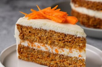Whenever you're craving a plant-based dessert, this Vegan Carrot Cake offers a moist, spiced cake filled with freshly grated carrots and topped with creamy dairy-free frosting, making it a wholesome and delicious treat for any occasion.