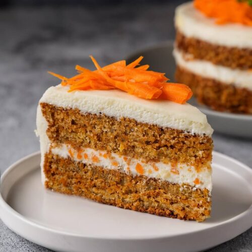 Whenever you're craving a plant-based dessert, this Vegan Carrot Cake offers a moist, spiced cake filled with freshly grated carrots and topped with creamy dairy-free frosting, making it a wholesome and delicious treat for any occasion.