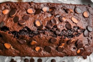 Indulge in the rich, decadent flavors of double chocolate banana bread. This moist and tender loaf combines ripe bananas with a double dose of chocolate – both cocoa powder and chocolate chips. Each slice is packed with gooey chocolate chunks and a subtle banana sweetness, making it the perfect treat for chocolate lovers. Ideal for breakfast, dessert, or a satisfying snack, this homemade chocolate banana bread is a crowd-pleaser for any occasion.