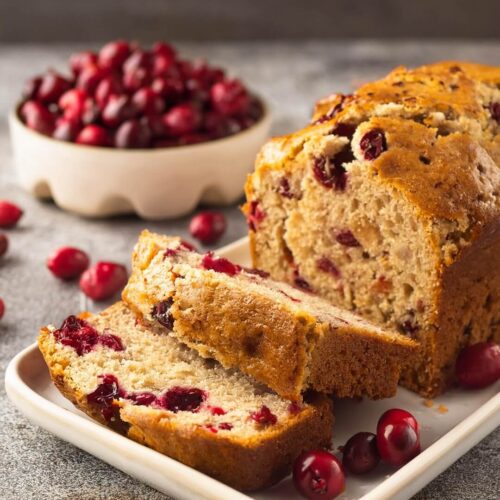 Whenever you want a festive and tangy treat, this Cranberry Bread combines tart, juicy cranberries with a soft, buttery loaf, making it the perfect addition to any holiday spread or cozy afternoon.