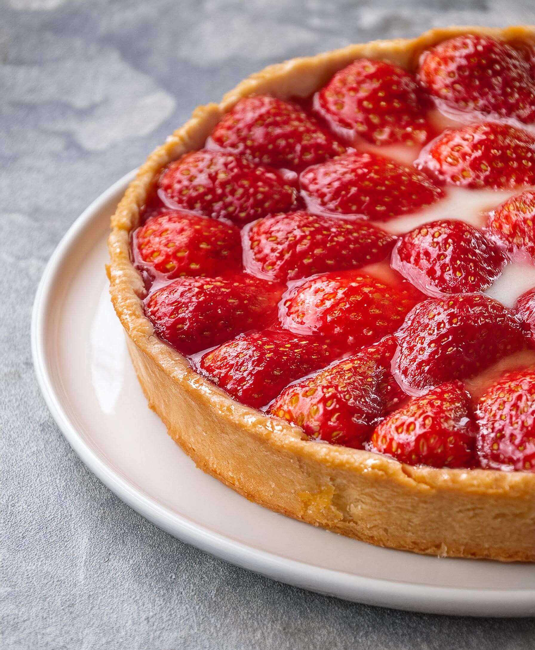 Whenever you want a taste of summer, this Strawberry Pie showcases a flaky crust filled with juicy, fresh strawberries, topped with a sweet glaze that makes every slice a refreshing delight.