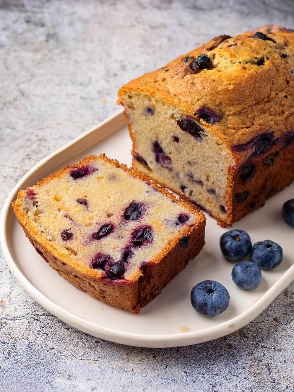 Moist and flavorful Blueberry Banana Bread, packed with ripe bananas and juicy blueberries, creating the perfect balance of sweetness and tartness. This easy-to-make quick bread features a tender crumb and is ideal for breakfast, a snack, or dessert. Bursting with fruity flavors in every bite, this homemade treat pairs wonderfully with a cup of coffee or tea.
