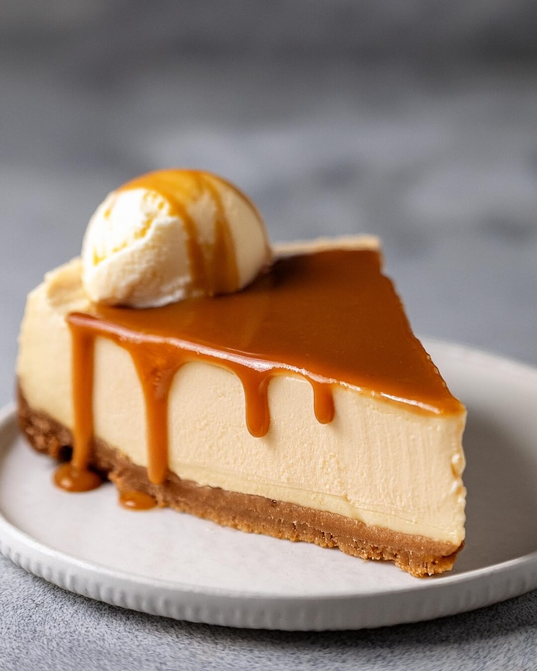 This Caramel Cheesecake is a luxurious dessert that combines creamy cheesecake with rich, velvety caramel for the ultimate indulgence! The smooth, tangy cheesecake sits atop a buttery graham cracker crust, perfectly complementing the sweetness of the homemade caramel sauce that’s generously drizzled on top. Each bite is a dreamy mix of creamy, sweet, and slightly tangy flavors that melt in your mouth. Whether for a special occasion or just because, this cheesecake is sure to impress and satisfy any sweet tooth.
