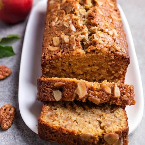 Moist and tender Apple Loaf Cake filled with chunks of fresh apples, warm cinnamon, and a hint of vanilla. This comforting cake is topped with a light cinnamon sugar crust, adding the perfect crunch to each bite. Bursting with fall flavors, this easy-to-make loaf is perfect for breakfast, dessert, or an afternoon snack, offering a delicious taste of homemade comfort.