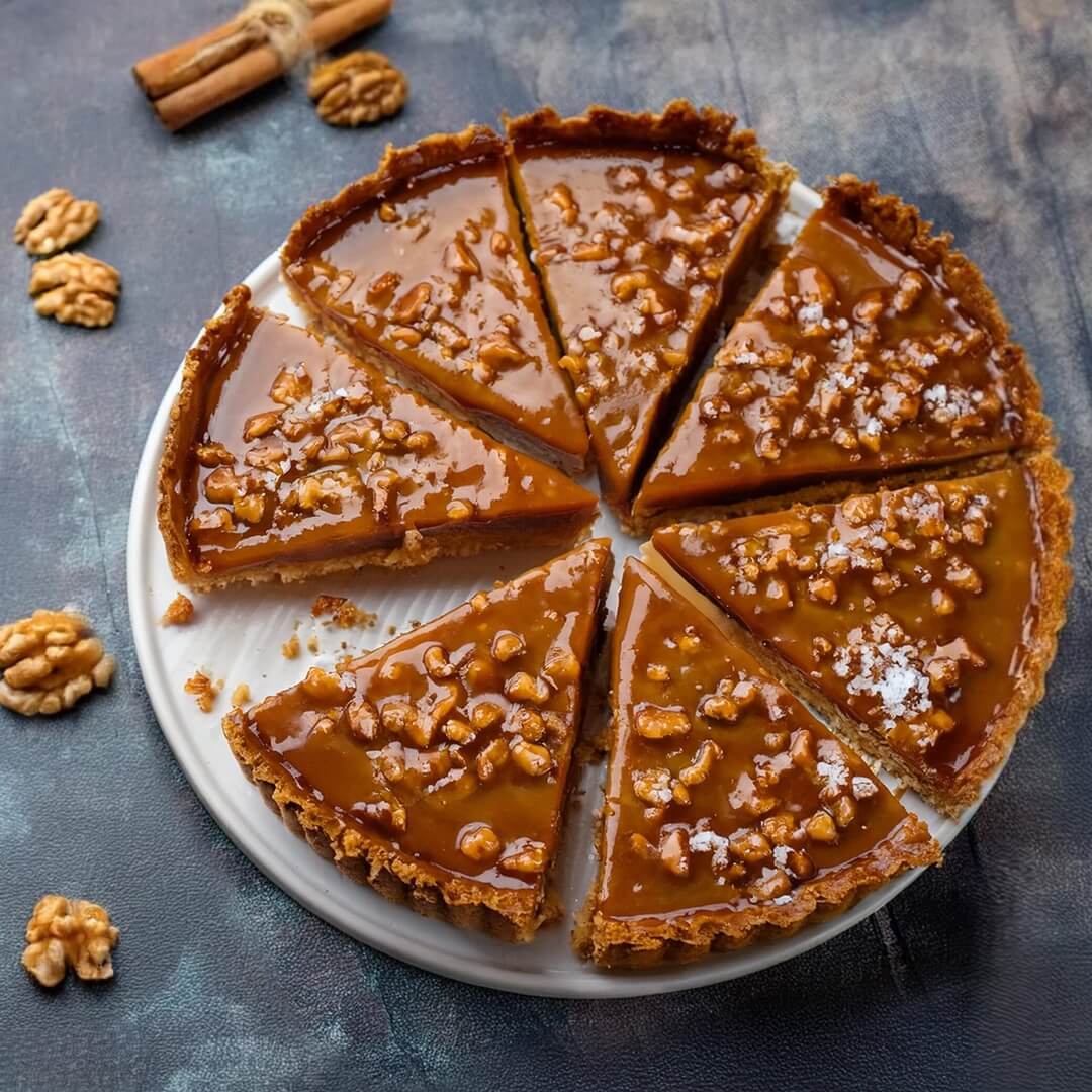 Whenever you're in the mood for a sweet-salty indulgence, this Salted Caramel Tart hits the spot with its buttery crust, rich caramel filling, and a perfect sprinkle of flaky sea salt. Each bite is a delightful balance of creamy sweetness and savory goodness, making it a show-stopping dessert for any occasion!
