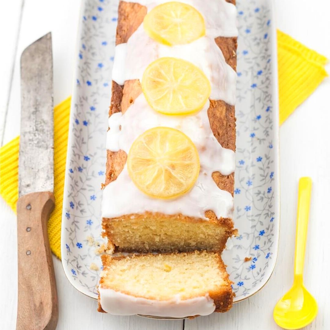 Lemon Cake With Icing – this is the perfect eggless and dairy-free lemon cake recipe! A soft, moist, simple-to-make and intensely lemon loaf cake soaked in tangy lemon syrup and topped with lemon glaze. This homemade lemon cake is sure to become a favorite!