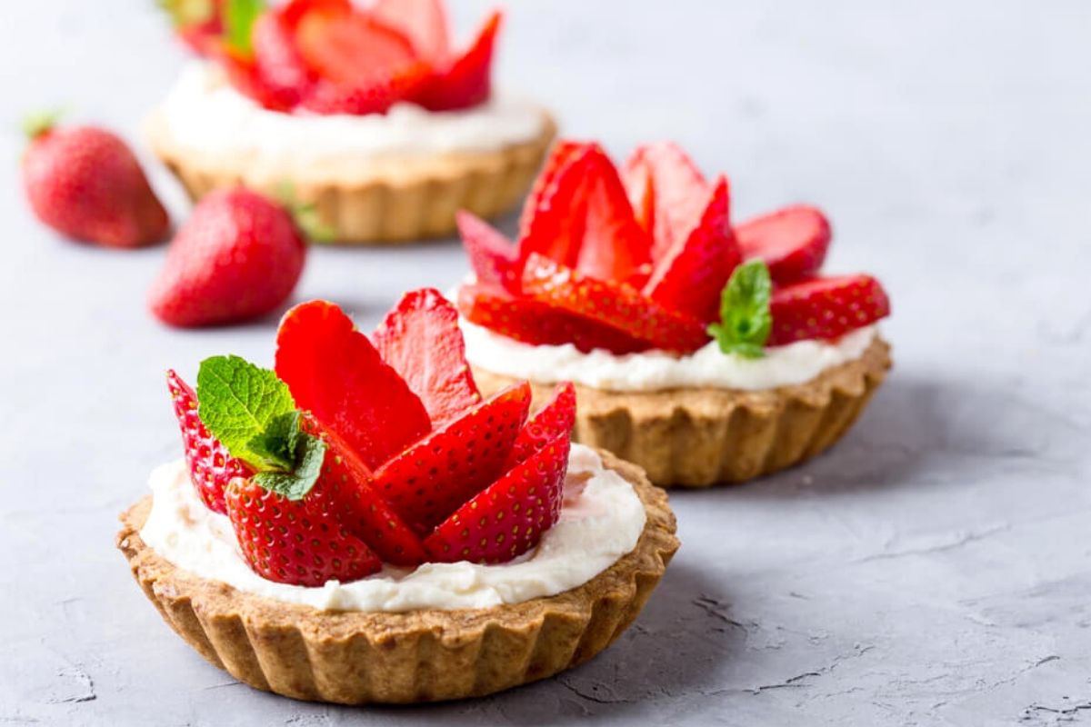 Strawberry Tartlets are the best summer and spring dessert! These little strawberry tarts have a short-bread crust, are filled with a sweet, creamy filling, and are topped with fresh strawberries.