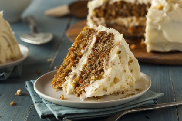 Indulge in the rich, moist decadence of our Carrot Cake. This beloved classic combines the natural sweetness of grated carrots with a medley of warm spices and a luscious cream cheese frosting. Every slice is a celebration of texture and flavor, with the satisfying crunch of walnuts and the smoothness of cream cheese icing. Whether it's a special occasion or an everyday treat, this cake is the embodiment of comfort and indulgence.