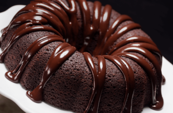 Indulge in the irresistible decadence of a rich and moist Chocolate Bundt Cake. This delectable dessert features a luscious chocolate glaze, making it the perfect treat for any chocolate lover's craving