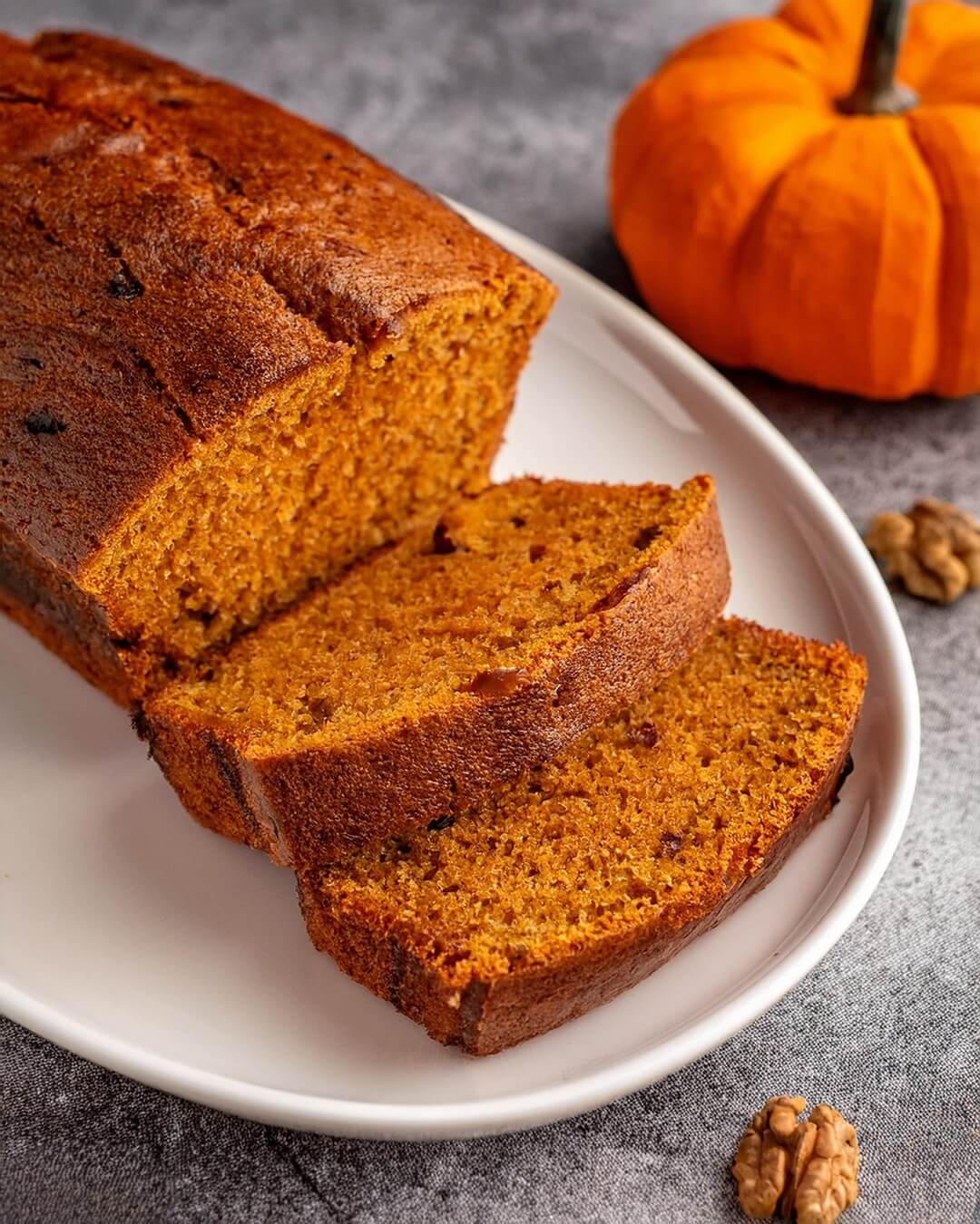 Moist and flavorful Pumpkin Bread, made with real pumpkin puree, warm spices like cinnamon and nutmeg, and a hint of vanilla. This delicious fall favorite is perfect for breakfast, an afternoon snack, or a cozy dessert. With its tender crumb and rich pumpkin flavor, this easy-to-make bread pairs wonderfully with a cup of coffee or tea.