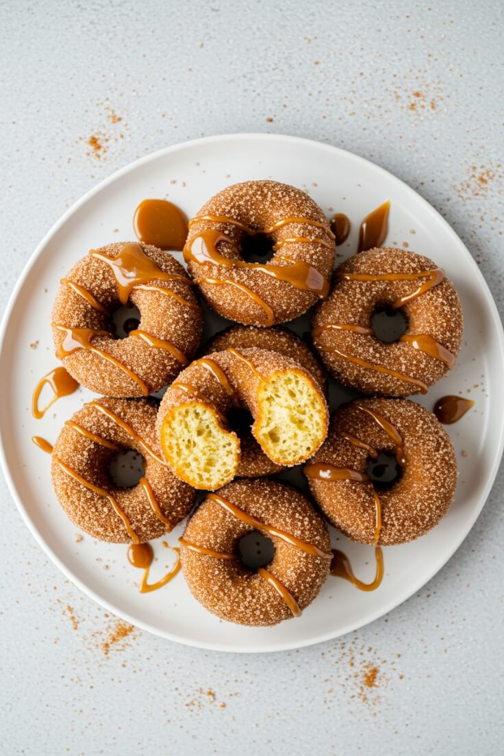 These Apple Cider Donuts are soft, spiced, and coated in cinnamon sugar. A cozy fall treat perfect for breakfast, brunch, or dessert.