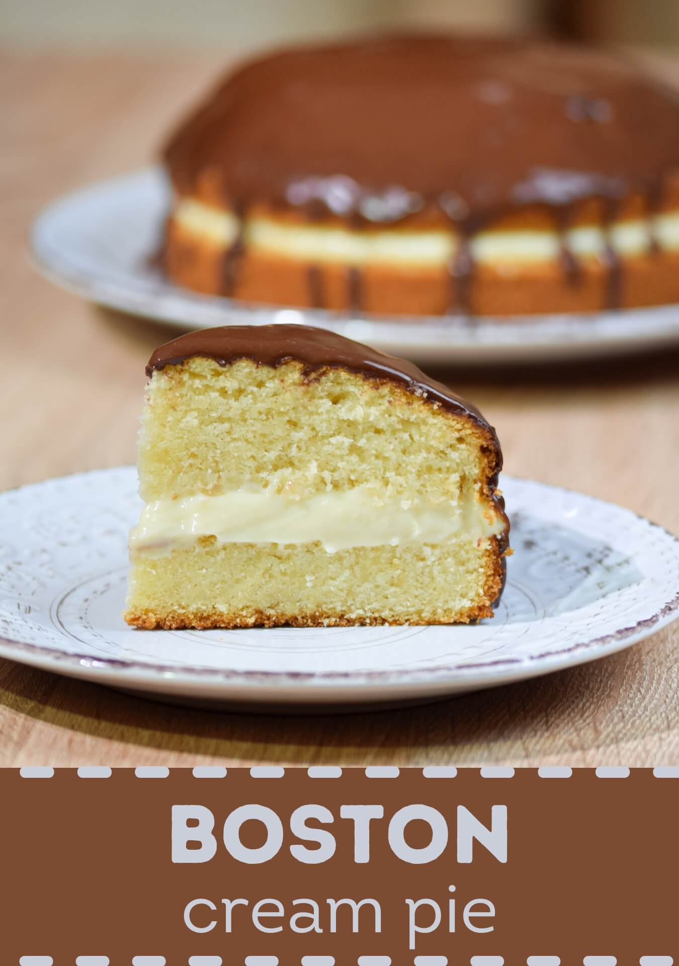 A traditional Boston Cream Pie is a delicious dessert made of soft layers of vanilla sponge cake. These layers are filled with creamy pastry and finished off with a glossy layer of chocolate ganache on top.