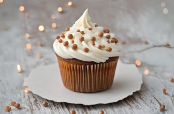 Delicious gingerbread cupcakes that bring the warm and comforting flavors of the holiday season to every bite. The cupcakes boast a rich, spiced aroma with hints of cinnamon, ginger, and molasses. Each moist and tender cupcake is a harmonious blend of sweet and spiced goodness. Topped with a velvety cream cheese frosting, these cupcakes offer a delightful contrast to the robust gingerbread flavors. To add a festive touch, a sprinkle of cinnamon or a gingerbread cookie crumb garnish can enhance the visual appeal. These gingerbread cupcakes are not just a treat for the taste buds; they are a charming addition to any holiday dessert table, capturing the nostalgic essence of festive baking