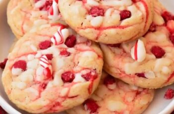 Irresistible peppermint white chocolate chip cookies that embody the festive spirit of the holiday season. These delightful treats feature a classic cookie base enriched with the cool, refreshing taste of peppermint. Studded generously with creamy white chocolate chips, each cookie promises a perfect blend of sweet and minty flavors. The dough may be infused with peppermint extract or finely crushed candy canes for an added burst of minty freshness. To enhance their visual appeal, these cookies can be adorned with a drizzle of white chocolate, creating an elegant finish. The combination of the peppermint and white chocolate creates a harmonious flavor profile that captures the essence of winter festivities. Whether enjoyed with a cup of hot cocoa or shared at holiday gatherings, these cookies are a delightful way to usher in the holiday cheer.