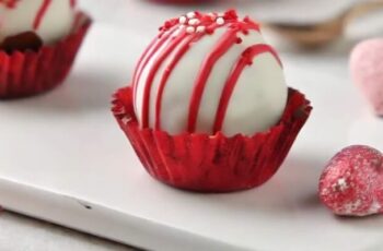 Delectable red velvet truffles that offer a bite-sized explosion of the classic red velvet flavor. These indulgent treats are made by combining red velvet cake crumbs with a velvety cream cheese frosting, creating a smooth and moist mixture. The truffle mixture is then rolled into bite-sized balls and coated in a layer of rich, melted chocolate, providing a luxurious outer shell. To enhance their visual appeal, a dusting of red velvet cake crumbs or a drizzle of contrasting chocolate can be added as a finishing touch. These red velvet truffles are perfect for gifting, serving at parties, or as a delightful dessert bite. They encapsulate the essence of red velvet cake in a convenient and shareable form, making them a crowd-pleaser for any occasion.