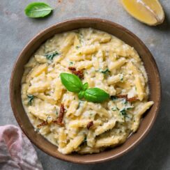 Deliciously creamy Tuscan Orzo made with tender orzo pasta simmered in a rich, garlic-Parmesan sauce, and packed with sun-dried tomatoes, spinach, and Italian herbs. This easy, one-pan dish offers a perfect balance of creamy textures and vibrant flavors. Ideal as a comforting main dish or a side, it's a satisfying meal that's ready in just minutes.
