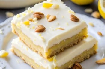 Delightful Lemon Sugar Cookie Bars that bring the bright and zesty flavor of lemon to a chewy and tender cookie bar form. These bars are perfect for those who love the refreshing taste of lemon in a convenient and shareable treat. The cookie bar base is typically made with a blend of flour, sugar, butter, and eggs, with the addition of lemon zest or lemon extract to infuse that citrusy goodness. The dough is pressed into a baking pan to create a uniform layer. After baking to a golden perfection, the bars may be finished with a dusting of powdered sugar or a simple lemon glaze for an extra burst of flavor and a hint of sweetness. Whether enjoyed as a snack, dessert, or at gatherings, these Lemon Sugar Cookie Bars offer a delightful and tangy twist on classic sugar cookies, making them a bright and sunny addition to any occasion.