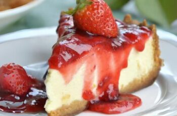 A classic and indulgent Strawberry Cheesecake that marries the creamy richness of cheesecake with the sweet and vibrant flavors of fresh strawberries. This dessert is perfect for spring and summer when strawberries are in season. The cheesecake typically starts with a buttery graham cracker crust, creating a delicious contrast to the creamy filling. The filling is made with cream cheese, sugar, eggs, and vanilla extract, creating a smooth and velvety texture. Fresh strawberry puree or diced strawberries are often folded into the cheesecake batter, infusing it with natural sweetness and a beautiful pink hue. Once baked to perfection, the cheesecake is chilled until set. Before serving, it can be topped with a layer of strawberry glaze or fresh strawberry slices for an extra burst of strawberry flavor and a visually appealing finish. This Strawberry Cheesecake is a timeless and crowd-pleasing dessert, perfect for special occasions, celebrations, or any time you want to savor the delightful combination of creamy cheesecake and luscious strawberries.