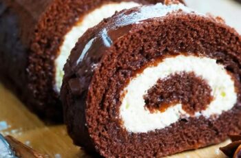 Dive into the world of decadence with our Chocolate Cake Roll, a show-stopping dessert that's as impressive to look at as it is delightful to eat. Envision a light and moist chocolate sponge cake, lovingly rolled around a velvety layer of chocolate ganache or whipped cream. Each slice reveals a beautiful spiral of cake and filling, creating a visual feast for the eyes. The rich chocolate flavor, combined with the melt-in-your-mouth texture, makes this Chocolate Cake Roll a heavenly treat for chocolate lovers. Whether served as a stunning centerpiece at celebrations or enjoyed as a simple indulgence, this dessert is a true masterpiece of flavor and presentation.