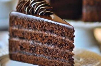 Indulge in the ultimate decadence with our Chocolate Mousse Cake, a luscious dessert that will satisfy even the most discerning chocolate lover. Picture layers of moist chocolate cake, sandwiched between velvety smooth layers of rich chocolate mousse. Each bite is a symphony of flavors and textures, with the moist cake providing the perfect contrast to the airy mousse. The cake is enrobed in a glossy chocolate ganache, adding an extra layer of indulgence and a beautiful shine. Whether served as a centerpiece at special occasions or enjoyed as a luxurious treat, our Chocolate Mousse Cake is a true celebration of chocolate in all its glory.