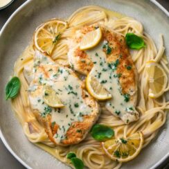 Delicious Creamy Lemon Chicken Piccata featuring tender, pan-seared chicken breasts in a rich, velvety lemon butter sauce. This dish is elevated with the bright flavors of fresh lemon juice, tangy capers, and a hint of garlic, creating a perfect balance of creaminess and zest. Served over pasta or with a side of steamed vegetables, this easy-to-make dish is ideal for a quick weeknight dinner or a special occasion