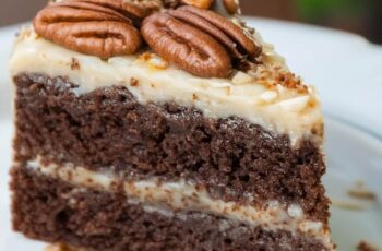 This German Chocolate Cake is incredibly moist, indulgently rich, and absolutely decadent! It's filled and frosted with a delightful coconut-pecan frosting that's both nutty and buttery—a real treat. This cake is bound to leave a lasting impression!