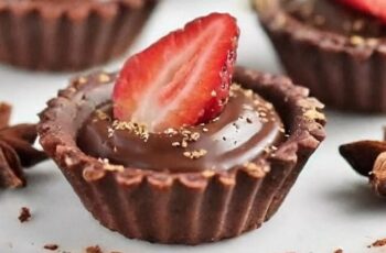 Indulge in bite-sized decadence with our Mini Chocolate Tarts, perfect for satisfying your sweet cravings in elegant miniature form. Picture delicate tart shells filled with rich and velvety chocolate ganache, each one a symphony of flavor and texture. The smooth and creamy chocolate filling is perfectly complemented by the crispness of the tart shell, creating a delightful contrast that melts in your mouth. Whether enjoyed as a sophisticated dessert at a dinner party or as a sweet indulgence for any occasion, our Mini Chocolate Tarts are sure to impress with their irresistible richness and elegance.