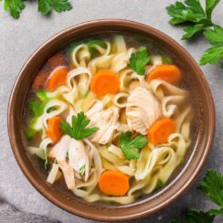 Comforting Slow Cooker Chicken Noodle Soup made with tender, slow-cooked chicken, hearty egg noodles, and fresh vegetables in a savory, herb-infused broth. This easy, hands-off recipe allows flavors to develop over time, resulting in a nourishing and satisfying soup that's perfect for chilly days or when you need a cozy, homemade meal. Ideal for a family dinner or meal prep, this soup is a timeless classic