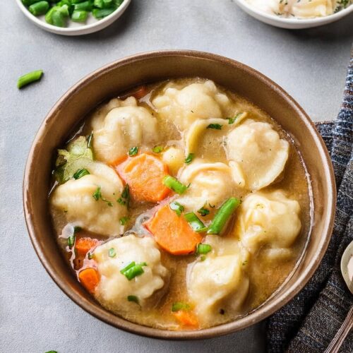 Classic Southern Chicken and Dumplings featuring tender, shredded chicken simmered in a rich, flavorful broth with fluffy, homemade dumplings. This comforting, hearty dish is made from scratch, combining savory herbs, creamy textures, and pillowy dumplings for the ultimate Southern comfort food. Perfect for family dinners or cozy nights in, this dish offers a taste of home with every bite