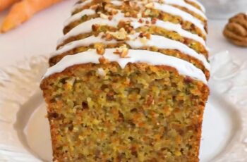 Indulge in the wholesome goodness of our Zucchini Carrot Bread, a delightful twist on the classic quick bread. Picture moist and tender loaves filled with grated zucchini and carrots, creating a vibrant and flavorful combination. Each slice is a harmonious blend of earthy sweetness from the carrots, subtle freshness from the zucchini, and warm spices like cinnamon and nutmeg. Whether enjoyed for breakfast with a smear of cream cheese or as a sweet snack any time of day, our Zucchini Carrot Bread is sure to be a hit with family and friends
