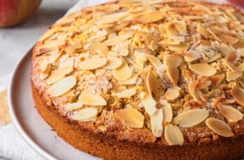 This Almond Apple Cake features a soft almond meal cake base, topped with tender apple slices, and finished with a simple flaked almond topping.