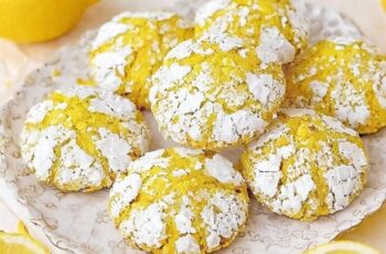 Indulge in the delightful tanginess of our Lemon Crinkle Cookies, a zesty twist on the classic crinkle cookie. Picture soft and chewy cookies bursting with bright lemon flavor, coated in a layer of powdered sugar that creates a delightful crinkle effect when baked. Each bite offers a perfect balance of sweetness and citrusy tang, with the refreshing zest of lemon shining through. Whether enjoyed with a cup of tea, as a sweet snack, or as a light dessert, our Lemon Crinkle Cookies are sure to brighten your day and leave you craving more.