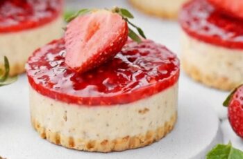 Savor the delightful sweetness of our Mini Strawberry Cheesecakes, perfect for indulging in a little taste of heaven. Picture creamy cheesecake filling nestled atop a buttery graham cracker crust, topped with a luscious layer of strawberry compote or fresh strawberries. Each bite-sized treat bursts with the fresh and fruity flavor of strawberries, perfectly complementing the rich and creamy cheesecake. Whether served as an elegant dessert for a special occasion or enjoyed as a sweet treat any time of day, our Mini Strawberry Cheesecakes are sure to delight your taste buds and leave you craving more.