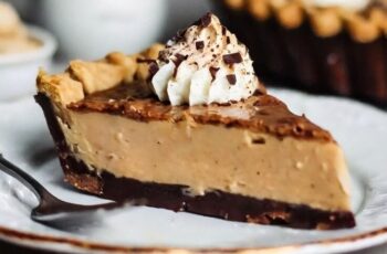 Indulge in the irresistible combination of creamy peanut butter and rich chocolate with our Peanut Butter Pie, a decadent dessert that's sure to satisfy any sweet tooth. Picture a buttery graham cracker crust filled with a luscious peanut butter filling, made with smooth peanut butter, cream cheese, and powdered sugar, then topped with a generous layer of chocolate ganache. Each bite is a symphony of flavors and textures, with the creamy peanut butter perfectly complementing the rich chocolate. Whether enjoyed as a dessert for a special occasion or as a sweet treat any time of day, our Peanut Butter Pie is sure to be a hit with family and friends.