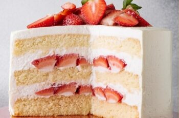 Indulge in the classic sweetness of our Strawberry Shortcake Cake, a delightful dessert that's perfect for celebrating the flavors of summer. Picture layers of light and fluffy vanilla cake, sandwiched together with freshly whipped cream and ripe, juicy strawberries. Each bite is a harmonious blend of airy cake, creamy frosting, and the natural sweetness of the strawberries. Whether enjoyed as a refreshing treat on a warm afternoon or as a show-stopping finale to a special meal, our Strawberry Shortcake Cake is sure to impress with its simplicity and deliciousness.