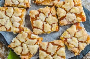 Experience the perfect balance of buttery richness and fruity sweetness with our Apricot Shortbread Bars. Imagine a golden-brown shortbread base, crumbly and melt-in-your-mouth tender, topped with a layer of luscious apricot jam. Each bite is a symphony of flavors, where the delicate sweetness of apricots meets the indulgent butteriness of the shortbread. These bars are a delightful treat for any occasion, whether enjoyed as a midday snack or a delightful dessert. With their irresistible aroma and heavenly taste, our Apricot Shortbread Bars are sure to become a new favorite.