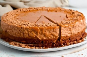 Indulge in the creamy richness of a baked Biscoff cheesecake. This decadent dessert features a smooth, velvety cheesecake filling on a crunchy Biscoff cookie crust. Topped with a generous drizzle of melted Biscoff spread and garnished with cookie crumbs, this cheesecake is a Biscoff lover's dream come true. Perfect for special occasions or as a delightful treat any day of the week.