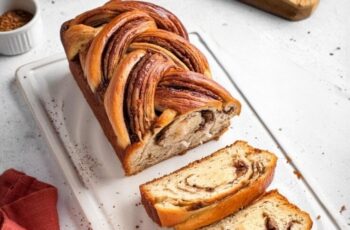 Indulge in the comforting aroma and rich flavors of our Cinnamon Babka. Imagine tender, buttery layers of sweet dough, generously swirled with cinnamon sugar to create intricate patterns of warmth and spice. Each slice offers a tantalizing combination of soft, pillowy texture and irresistible sweetness, perfect for any time of day. Whether enjoyed with a morning coffee or as a decadent dessert, our Cinnamon Babka is a timeless classic that promises to satisfy every craving