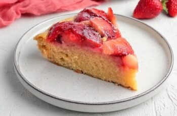Delight in the delightful combination of sweet strawberries and buttery cake with our Strawberry Upside Down Cake, a classic dessert that's sure to impress. Picture a moist and tender cake base topped with a layer of caramelized strawberries, creating a beautiful and delicious presentation when flipped upside down. Each slice is a perfect balance of fruity sweetness and rich buttery flavor, with the juicy strawberries infusing the cake with their vibrant color and delicious taste. Whether enjoyed as a sweet ending to a summer barbecue or as a comforting treat on a chilly day, our Strawberry Upside Down Cake is sure to be a hit with family and friends.