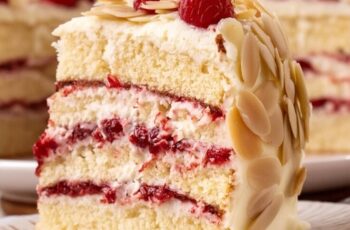 Indulge in the delightful combination of sweet white chocolate, nutty almonds, and tangy raspberries with our White Chocolate Almond Raspberry Cake, a luxurious dessert that's perfect for special occasions. Picture layers of moist and tender almond-flavored cake, filled with luscious white chocolate ganache and fresh raspberry preserves, and frosted with creamy white chocolate buttercream. Each slice is a symphony of flavors and textures, with the creamy sweetness of the white chocolate perfectly complementing the nuttiness of the almonds and the tartness of the raspberries. Whether enjoyed as a show-stopping dessert for a celebration or as a decadent treat to indulge in any time of day, our White Chocolate Almond Raspberry Cake is sure to impress with its elegant presentation and delicious taste.