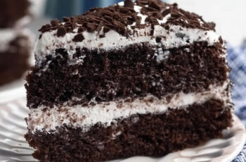 Do you love Oreos? This Cookies 'n Cream Oreo Cake is packed with chocolate and Oreo flavor. It's a dark chocolate cake filled with marshmallow buttercream and lots of Oreos! In this post, you'll learn how to make this amazing Oreo cake. Plus, the cake itself is egg-free and dairy-free!